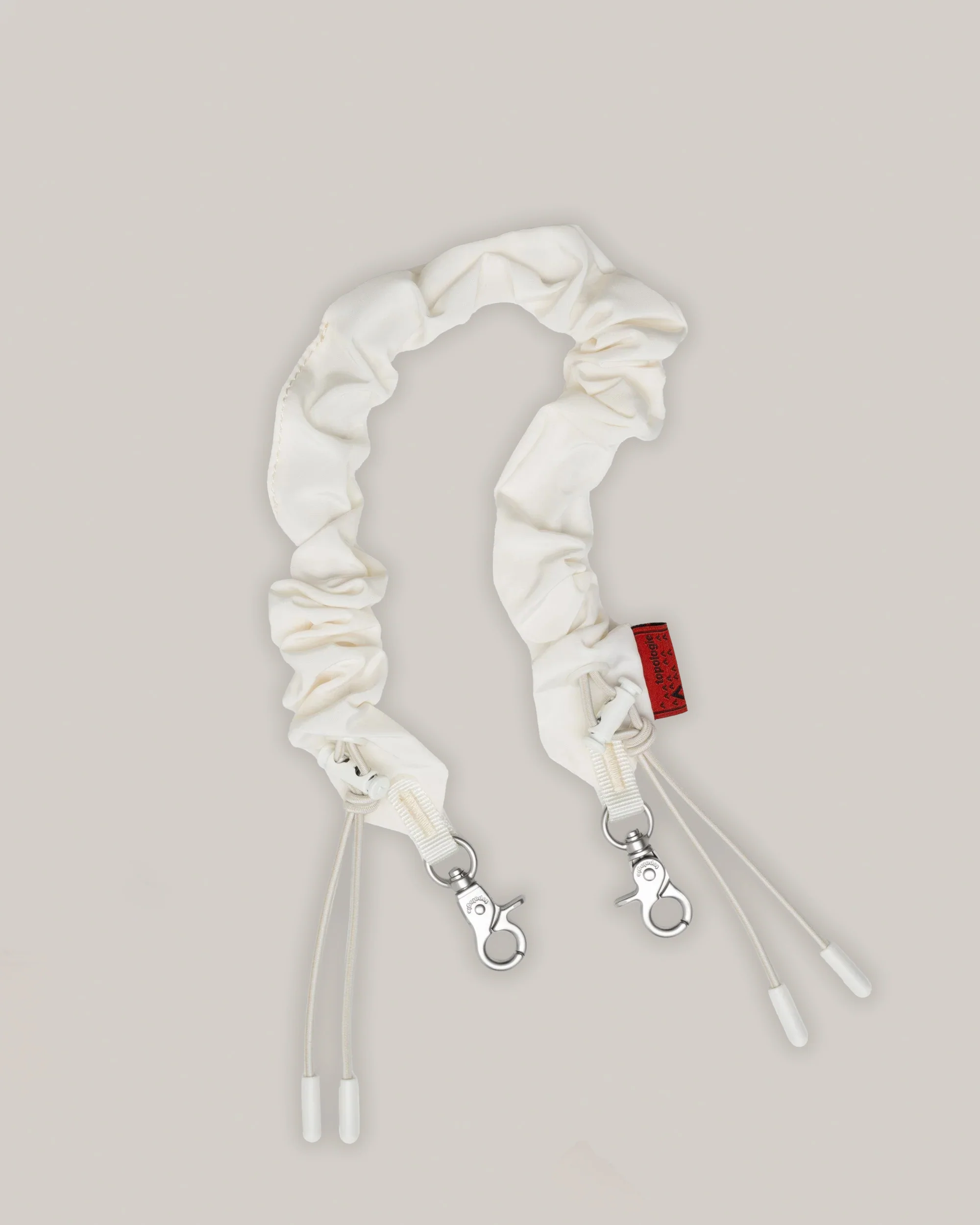 TOPOLOGIE BUNGEE WRIST STRAP OFF WHITE TECH SATEEN