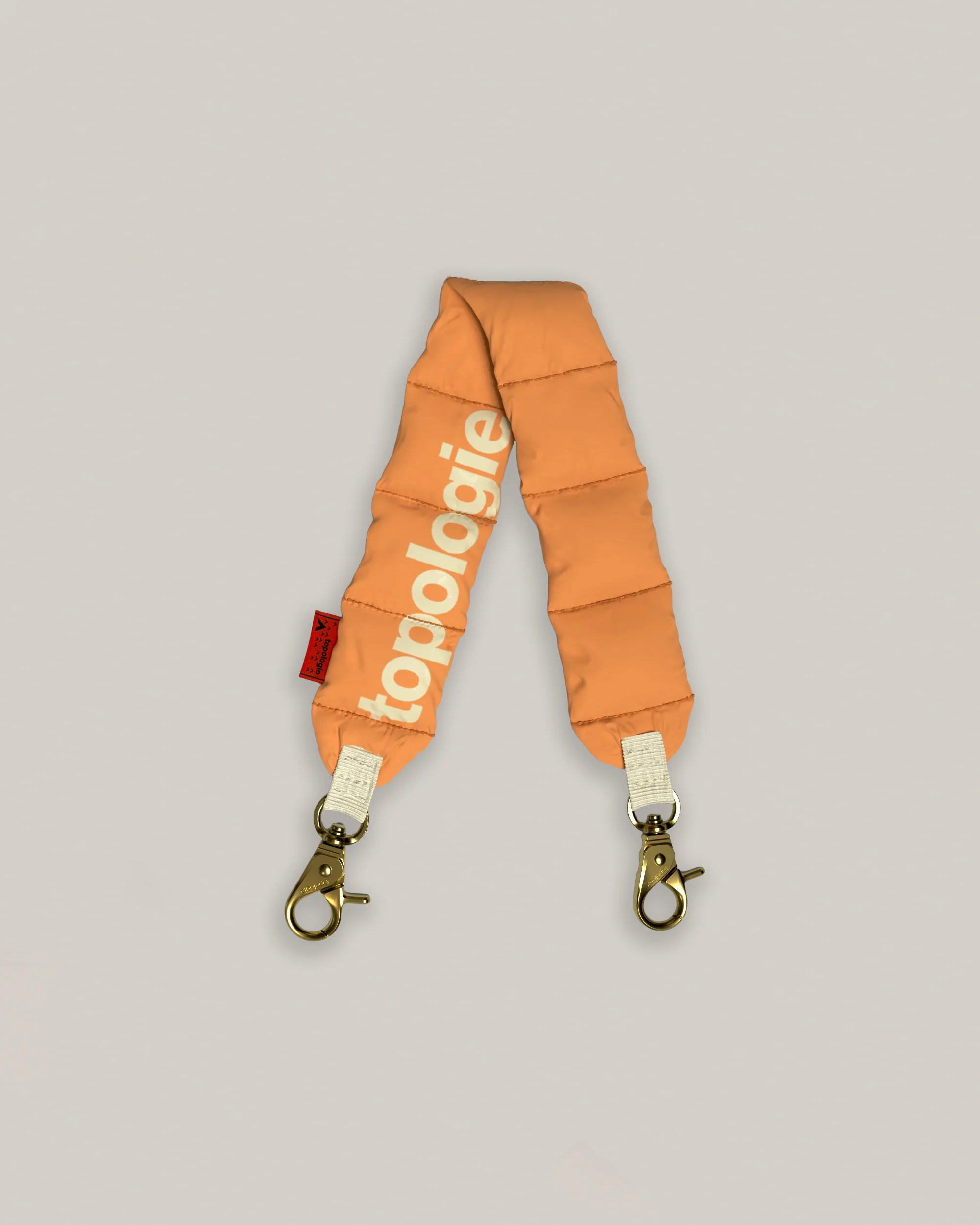 TOPOLOGIE PUFFER WRIST STRAP ORANGE TECH SATEEN